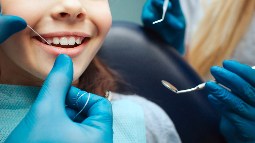 A picture of a young student receiving dental care 