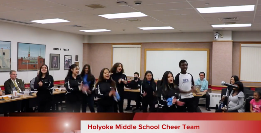 HMS cheer team performs routines for School Committee