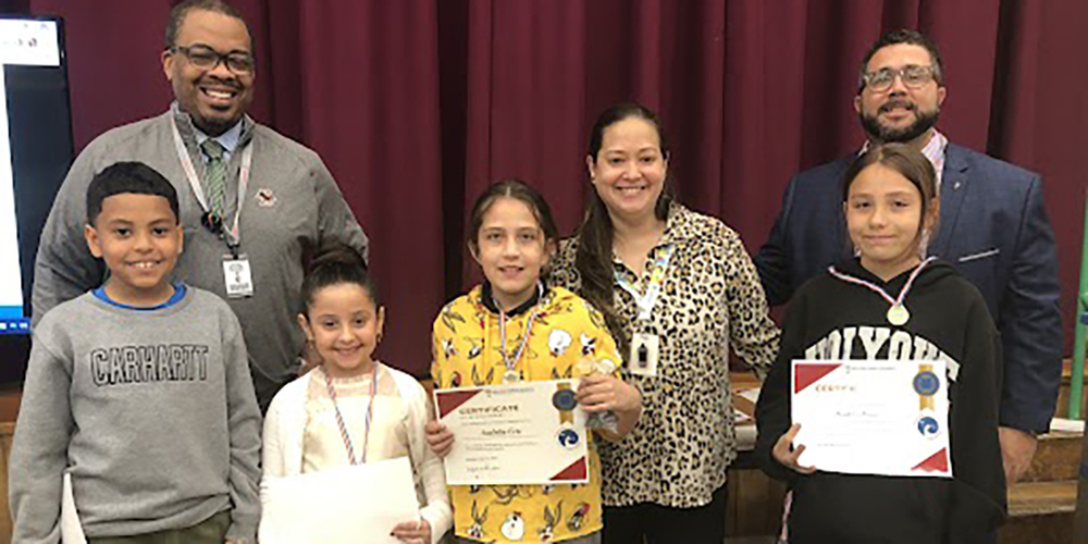 Group of students displaying their awards