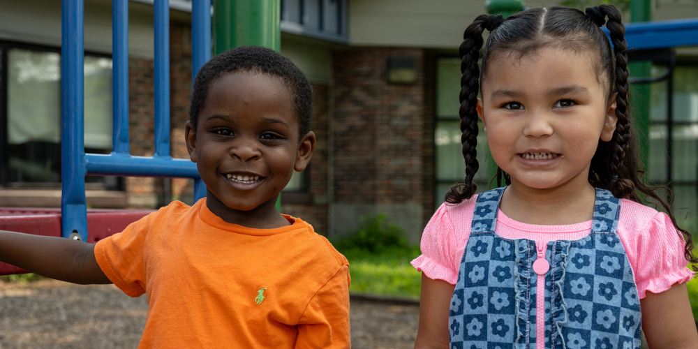 Two Extended School Year students from Donahue smiling as they line up sided to side for a picture. 