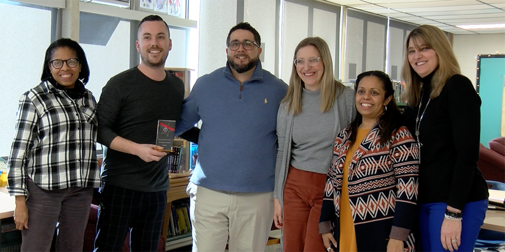 Superintendent Soto standing in center with Sullivan School staff