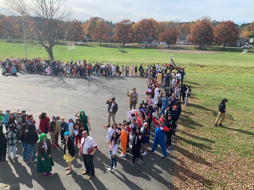 Group of students outside in their halloween costumes.
