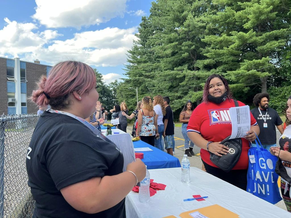 Holyoke Middle School Staff greeting famlies. 