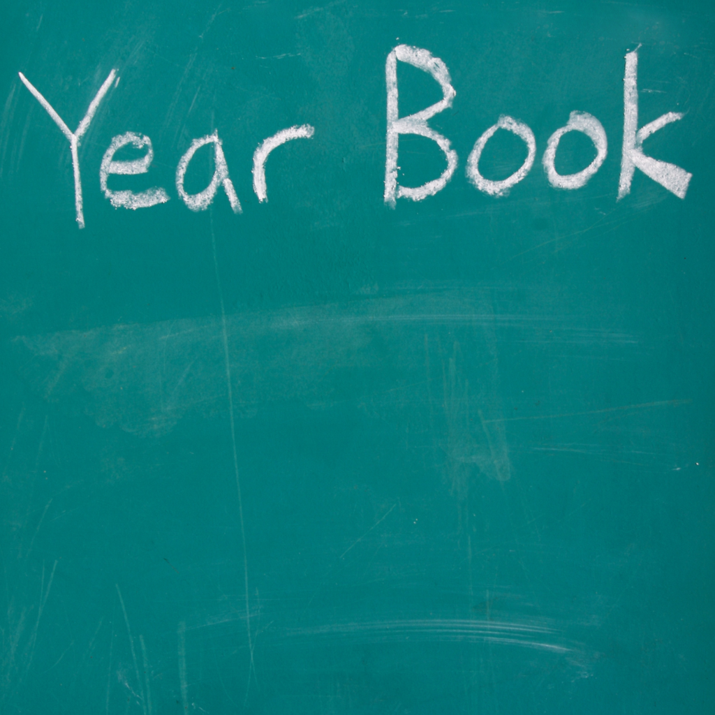 Green chalk board with Year Book written in chalk