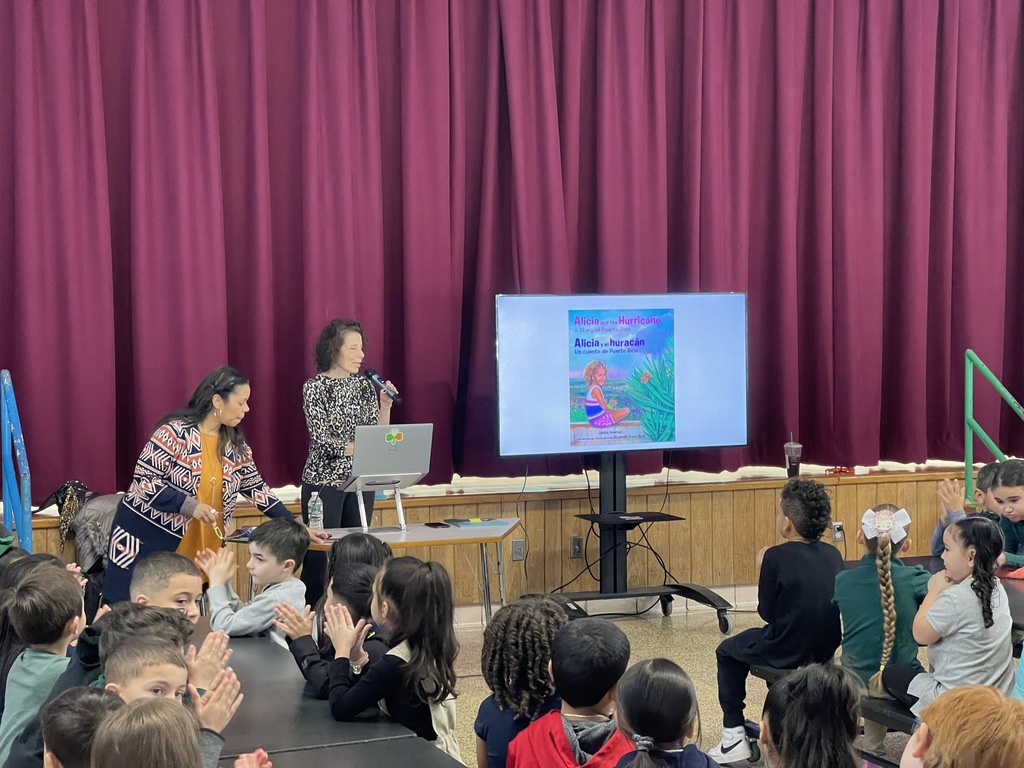 Students from Sullivan School enjoy reading the book Alicia and the Hurricane, A Story of Puerto Rico