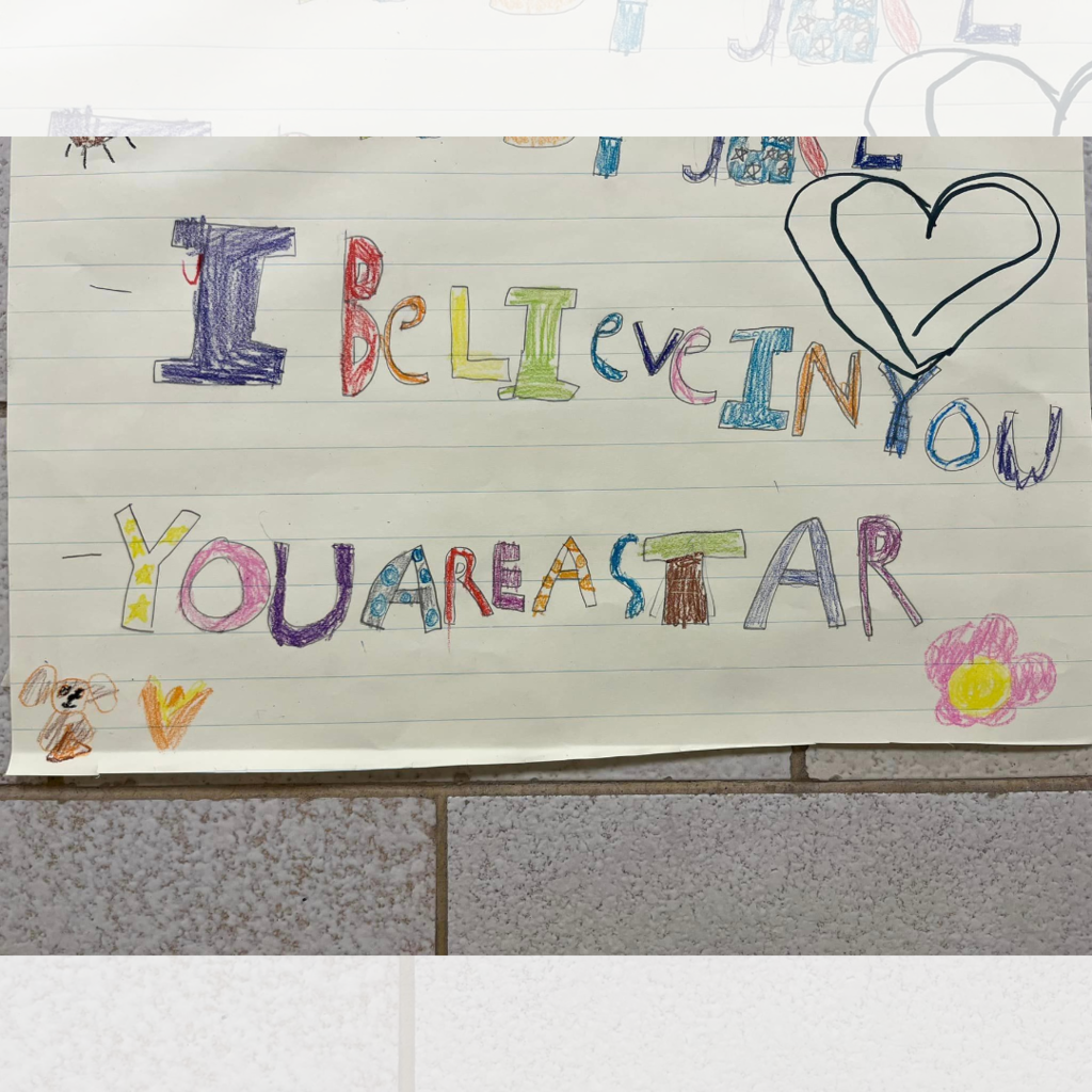A poster that says " I believe in you" and "You are a star" with a heart above the text.
