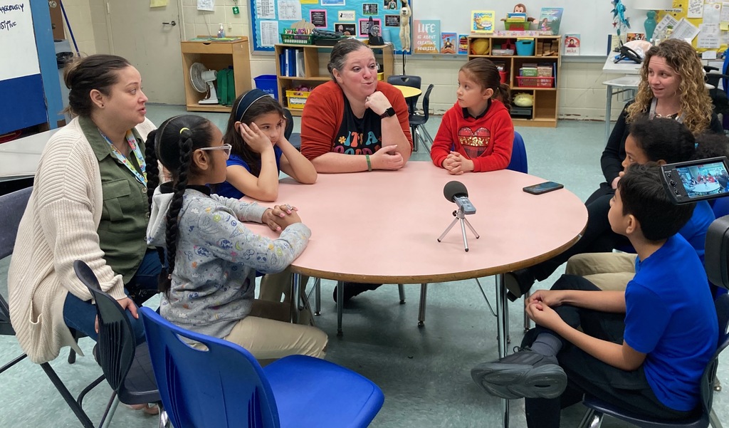 Donahue students and staff record a podcast.