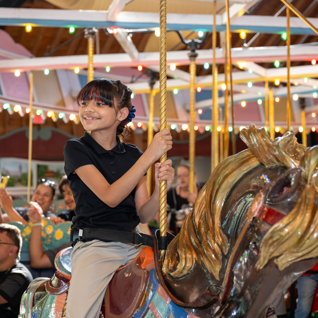 A girl in the Holyoke Merry Go Round. 
